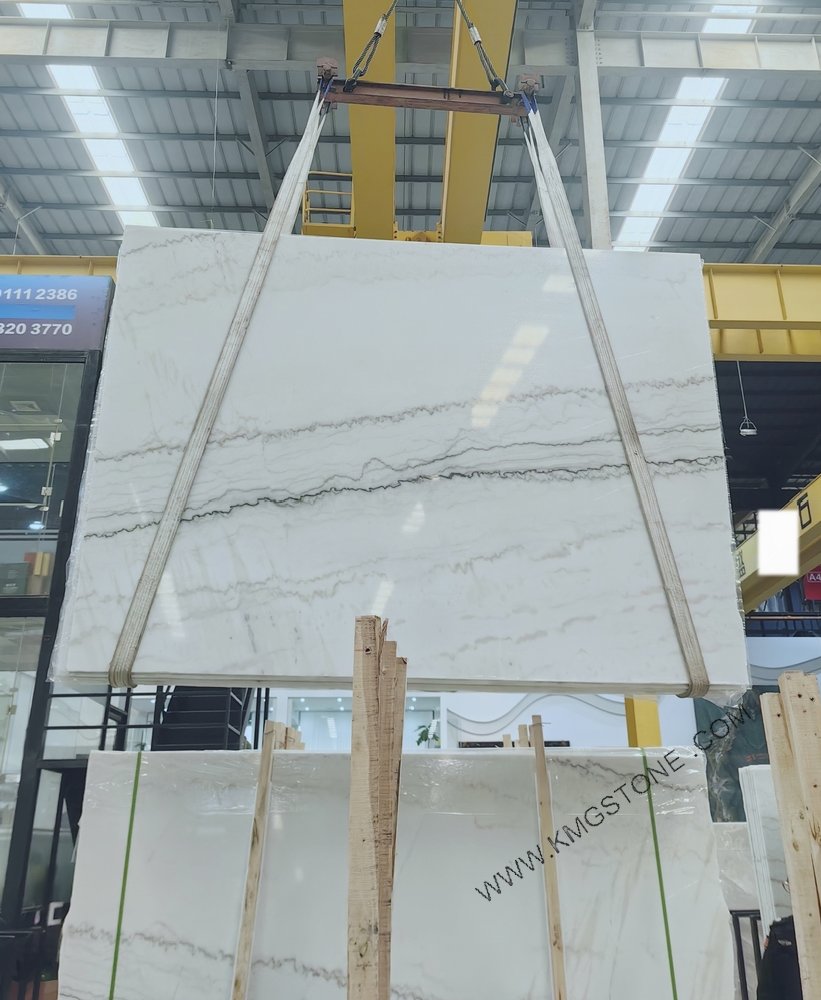 THOUGHTS: The user wants me to translate a product name into Vietnamese.
I need to:
1.  **Only translate the product name.**
2.  **Not translate instructions, options, or add anything else.**
3.  **If there are multiple lines, only translate the first line.**

The provided text is:
"Polished White Marble Slab Kitchen Counter TV Background Wall Villa Floor Stairs Decor-Natural Technique Waterproof"

This looks like one long product name, not multiple lines. So I need to translate the whole thing.

Let's break it down:
*   **Polished White Marble Slab:** Tấm đá cẩm thạch trắng bóng/đánh bóng
*   **Kitchen Counter:** Bàn bếp
*   **TV Background Wall:** Tường nền TV
*   **Villa Floor:** Sàn biệt thự
*   **Stairs Decor:** Trang trí cầu thang
*   **Natural Technique Waterproof:** Chống thấm kỹ thuật tự nhiên (This part seems like a feature/description rather than part of the core product name, but the instruction is to translate the "product name", and it's all one string. I should probably include it unless it clearly falls into "instructions/options"). Given the dash separating "Decor" and "Natural Technique Waterproof", it might be interpreted as a separate feature appended to the main product description. However, the instruction is clear: "chỉ dịch dòng đầu tiên". And this is all one line. So, I will translate the whole string as one product name.

Let's try to make it sound natural in Vietnamese.

"Polished White Marble Slab" -> "Tấm đá cẩm thạch trắng đánh bóng" or "Tấm đá hoa cương trắng bóng" (Marble is cẩm thạch, but sometimes hoa cương is used broadly for decorative stone, but cẩm thạch is more precise here).
"Kitchen Counter TV Background Wall Villa Floor Stairs Decor" -> This is a list of *uses* or *applications*.
"Natural Technique Waterproof" -> "Chống thấm kỹ thuật tự nhiên"

Combining them:
Option 1 (literal list of uses): Tấm đá cẩm thạch trắng đánh bóng dùng cho Bàn bếp, Tường nền TV, Sàn biệt thự, Trang trí cầu thang - Chống thấm kỹ thuật tự nhiên.
This sounds a bit clunky. Product names in Vietnamese often focus on the core product first, then its features/uses.

Let's try to rephrase the uses more smoothly.
"Tấm đá cẩm thạch trắng đánh bóng" (Core product)
"Dùng cho bàn bếp, tường nền TV, sàn biệt thự, trang trí cầu thang" (Uses)
"Kỹ thuật tự nhiên chống thấm" (Feature)

Maybe the uses should be integrated into the product description for a title.
"Tấm đá cẩm thạch trắng đánh bóng cho Bàn bếp, Tường nền TV, Sàn biệt thự, Trang trí cầu thang" - "Kỹ thuật chống thấm tự nhiên".

Let's look at the structure again: "Polished White Marble Slab" is the main item. The rest "Kitchen Counter TV Background Wall Villa Floor Stairs Decor" describes its applications. "Natural Technique Waterproof" is a feature.

A common way to list applications in product titles:
"Tấm đá cẩm thạch trắng đánh bóng" (Main product)
"Dùng làm Bàn bếp, Tường nền TV, Sàn biệt thự, Trang trí cầu thang" (Applications)
"Kỹ thuật chống thấm tự nhiên" (Feature)

Let's try to condense:
"Tấm Đá Cẩm Thạch Trắng Đánh Bóng - Cho Bàn Bếp, Tường Nền TV, Sàn Biệt Thự, Trang Trí Cầu Thang - Chống Thấm Kỹ Thuật Tự Nhiên"

This looks good. It translates all parts, stays on one line, and doesn't add anything extra.
"Polished White Marble Slab" -> Tấm Đá Cẩm Thạch Trắng Đánh Bóng
"Kitchen Counter TV Background Wall Villa Floor Stairs Decor" -> Cho Bàn Bếp, Tường Nền TV, Sàn Biệt Thự, Trang Trí Cầu Thang
"Natural Technique Waterproof" -> Chống Thấm Kỹ Thuật Tự Nhiên

The dashes in the original can be translated as dashes or slightly rephrased for flow. Keeping them as dashes (or implied separation) is fine for a direct translation of a product name format.

Let's refine the "Decor" part. "Stairs Decor" can be "trang trí cầu thang".

Final proposed translation: "Tấm Đá Cẩm Thạch Trắng Đánh Bóng Dùng Cho Bàn Bếp, Tường Nền TV, Sàn Biệt Thự, Trang Trí Cầu Thang – Chống Thấm Kỹ Thuật Tự Nhiên"

I used "Dùng Cho" instead of just "Cho" to be slightly more explicit about the purpose.
The instruction "chỉ dịch dòng đầu tiên" is crucial. Since there is only one line, I translate the whole line.
"không dịch hướng dẫn, không dịch các lựa chọn, không thêm gì khác." - I adhered to this.

One more check for naturalness.
"Polished White Marble Slab" -> "Tấm Đá Cẩm Thạch Trắng Đánh Bóng" (or "Tấm Đá Cẩm Thạch Trắng Bóng") - Both are fine. "Đánh bóng" emphasizes the *action* of polishing, "bóng" describes the *state* of being polished. "Đánh bóng" might be slightly more common in product descriptions.

"Kitchen Counter TV Background Wall Villa Floor Stairs Decor" -> "Bàn Bếp, Tường Nền TV, Sàn Biệt Thự, Trang Trí Cầu Thang". This is a list of applications.
"Natural Technique Waterproof" -> "Chống Thấm Kỹ Thuật Tự Nhiên".

Let's put it together as if it were a single string like the original:
"Tấm Đá Cẩm Thạch Trắng Đánh Bóng Bàn Bếp Tường Nền TV Sàn Biệt Thự Trang Trí Cầu Thang – Kỹ Thuật Tự Nhiên Chống Thấm"
This sounds a bit like a jumble of nouns.
It's better to explicitly state "dùng cho" or "dành cho" for the applications.

Let's stick with the structure that reflects the intent of the product name, which lists the item, then its uses, then its features.
"Tấm Đá Cẩm Thạch Trắng Đánh Bóng - Cho Bàn Bếp, Tường Nền TV, Sàn Biệt Thự, Trang Trí Cầu Thang - Chống Thấm Kỹ Thuật Tự Nhiên"
This directly translates the meaning while keeping the format.
The use of dashes in Vietnamese product names to separate sections is also common.

Final check on the instruction: "Chỉ dịch sang tiếng Việt tên sản phẩm sau, không dịch hướng dẫn, không dịch các lựa chọn, không thêm gì khác. Nếu có nhiều dòng, chỉ dịch dòng đầu tiên:"
The input is one line. No extra instructions/options. Just the product name.

My translation: "Tấm Đá Cẩm Thạch Trắng Đánh Bóng - Cho Bàn Bếp, Tường Nền TV, Sàn Biệt Thự, Trang Trí Cầu Thang - Chống Thấm Kỹ Thuật Tự Nhiên"

This accurately translates all components of the single line, maintaining its original product name intent and not adding anything extraneous.